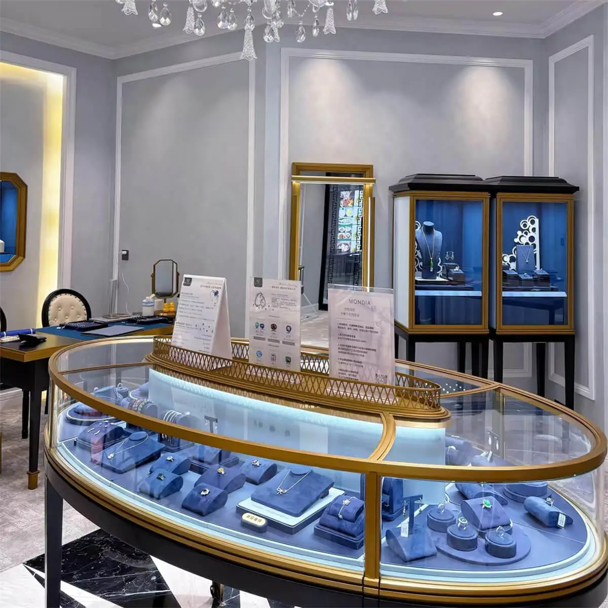 Luxury Oval Island Jewelry Showcase featuring professional boutique display layout and elegant store interior design.